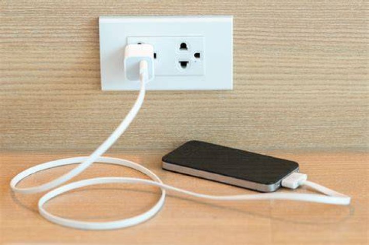 How do you charge your phone with coins?